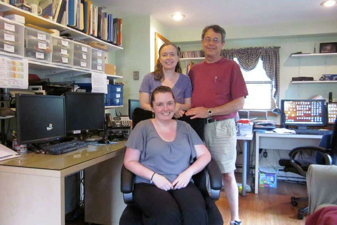 Photo: Company founders, Shannon and Fred Converse (standing); office manager, Erin Bennedum (seated)